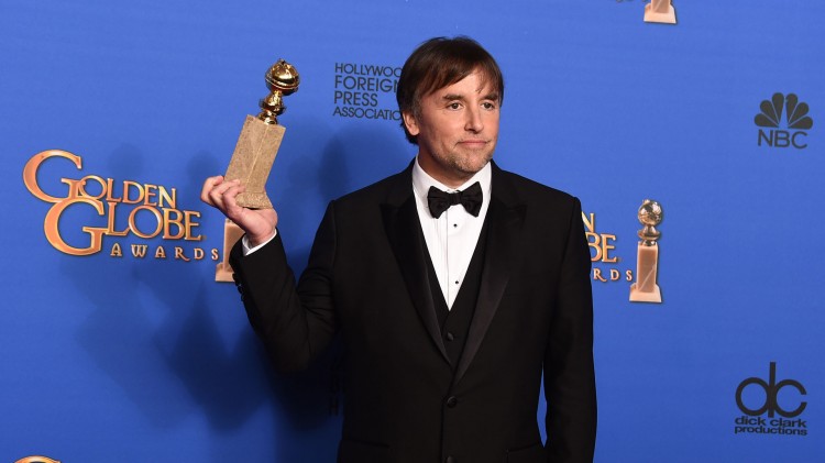 Regissør Richard Linklater med prisen for beste dramafilm for 'Boyhood'. (Foto: Jordan Strauss/Invision/AP, NTB Scanpix).