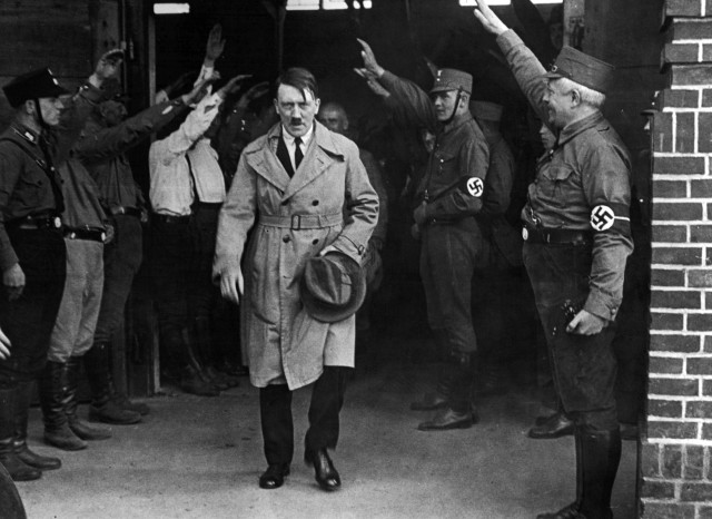 FILE - In this Dec. 5, 1931 file photo, Adolf Hitler, leader of the National Socialists, is saluted as he leaves the party's Munich headquarters. In Munich, Hitler launched his political career with speeches condemning Jews and proclaiming the ethnic superiority of Germans