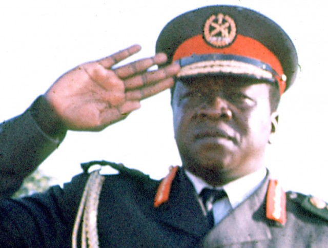 Ugandan dictator Idi Amin is shown saluting during an Organization of African Unity conference in Kampala, Uganda, in 1975.  