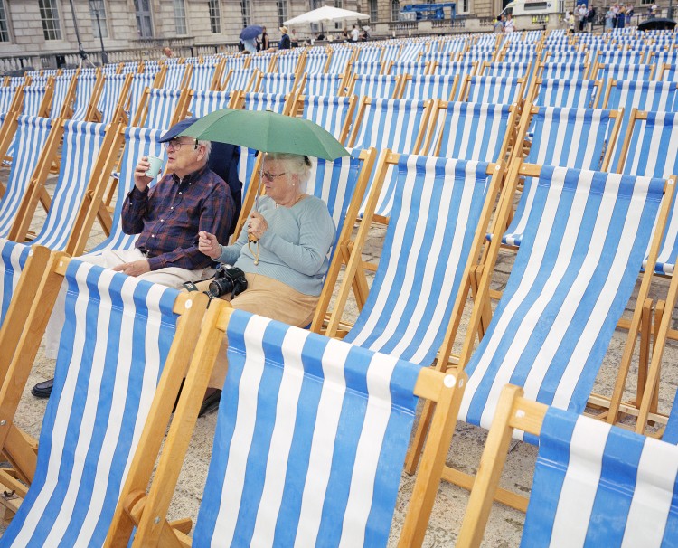 Spectators wait for a music concert to begin at Somerset House.